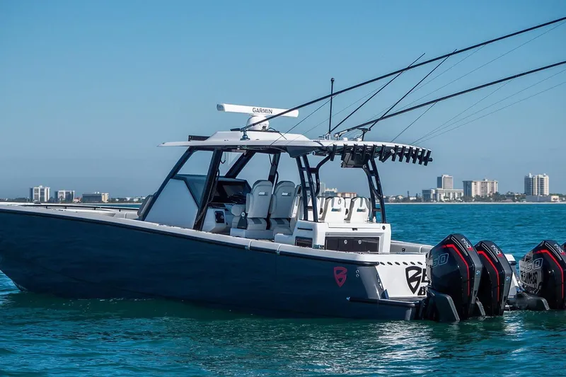  Yacht Photos Pics 2026 Barker Boatworks 40HPC on water, featuring multiple outboard engines and sleek design.