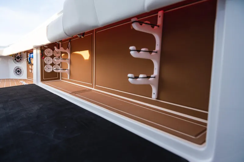  Yacht Photos Pics 2026 Barker Boatworks 40HPC interior storage with rod holders and speakers.