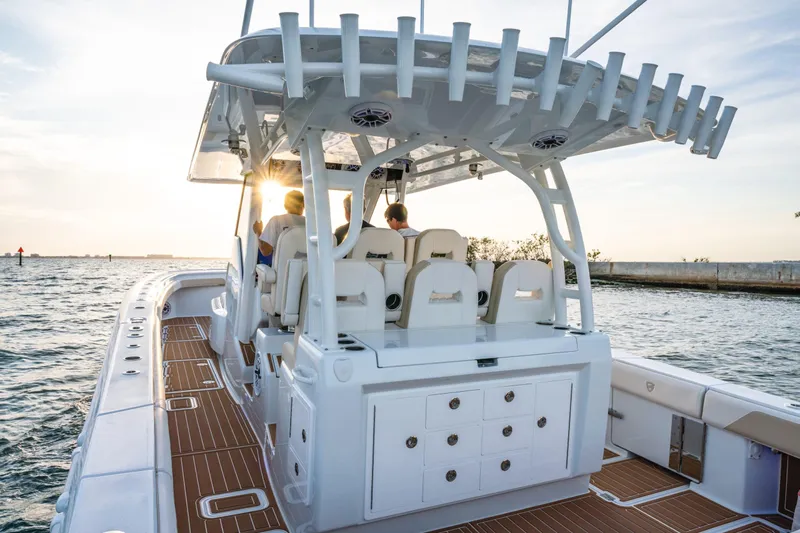  Yacht Photos Pics 2026 Barker Boatworks 40HPC cruising at sunset, featuring spacious deck and modern design.