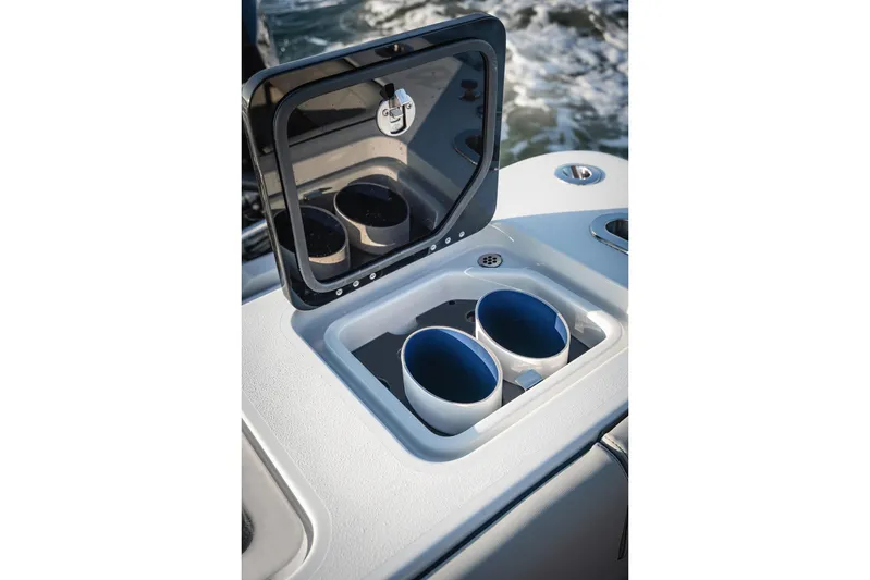  Yacht Photos Pics Cup holders on 2026 Barker Boatworks 40HPC, featuring a sleek design and open compartment.