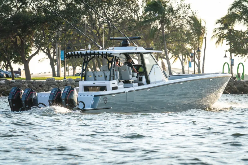  Yacht Photos Pics 2026 Barker Boatworks 40HPC cruising on water with triple outboard engines.