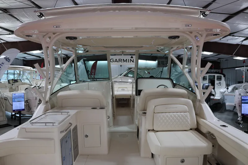  Yacht Photos Pics 2026 Grady-White Freedom 325 boat interior with Garmin equipment in a showroom.
