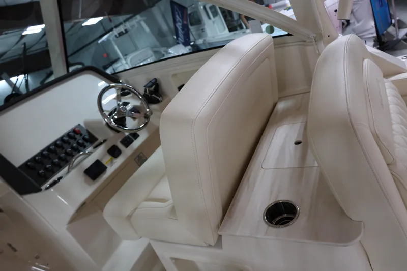  Yacht Photos Pics Interior of 2026 Grady-White Freedom 325 boat, featuring helm and seating area.