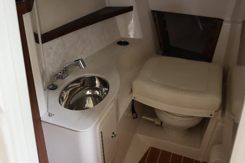  Yacht Photos Pics 2026 Grady-White Freedom 325 boat interior with sink and toilet.