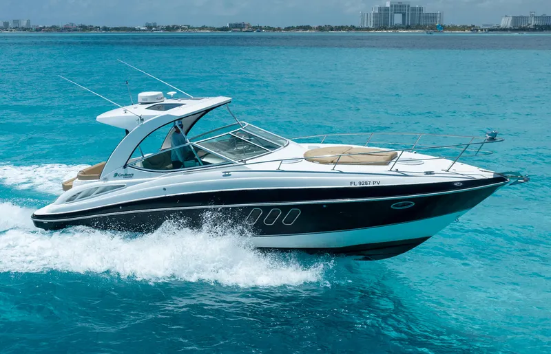 2015 Cruisers Yachts 350 Express Yacht Photos Pics 2015 Cruisers Yachts 350 Express cruising on clear blue ocean waters.