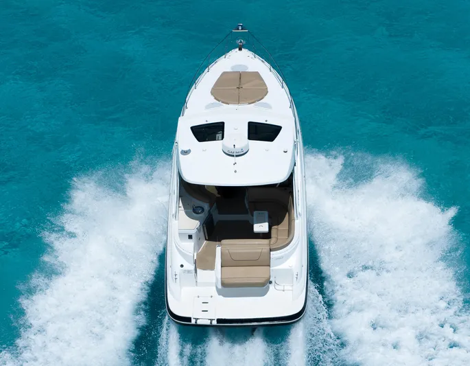 2015 Cruisers Yachts 350 Express Yacht Photos Pics 2015 Cruisers Yachts 350 Express cruising on clear blue water, aerial view.