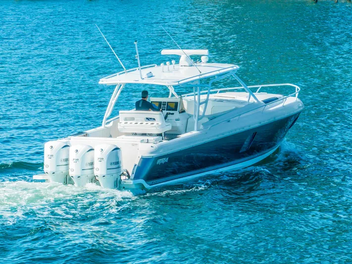  Yacht Photos Pics 2016 Intrepid 400 Cuddy boat cruising on blue water.