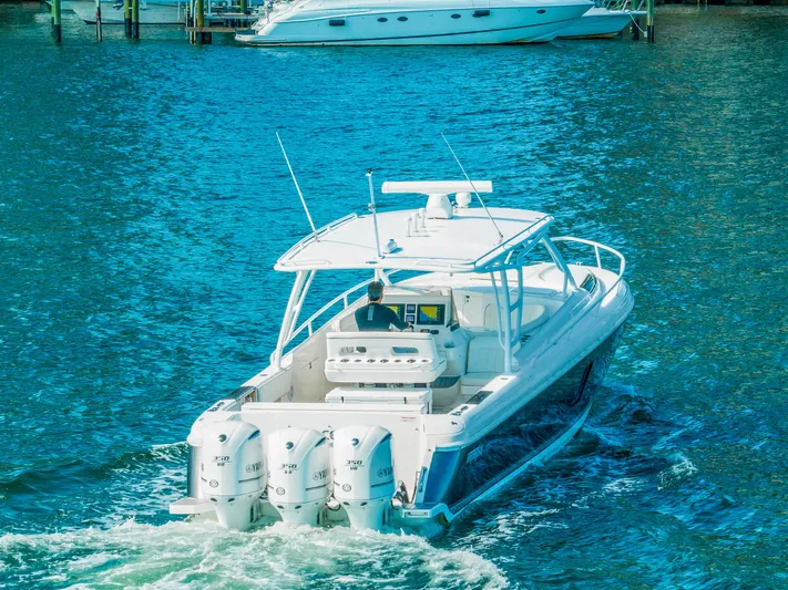  Yacht Photos Pics 2016 Intrepid 400 Cuddy boat cruising on blue water.