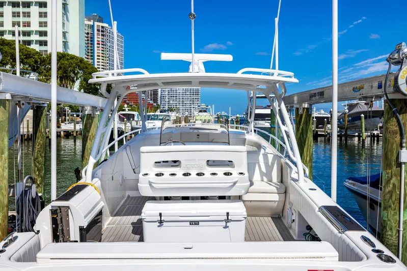  Yacht Photos Pics 2016 Intrepid 400 Cuddy boat docked at a marina with cityscape background.