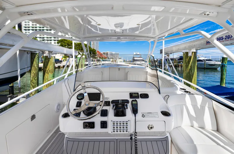  Yacht Photos Pics 2016 Intrepid 400 Cuddy boat helm with modern controls docked at marina.