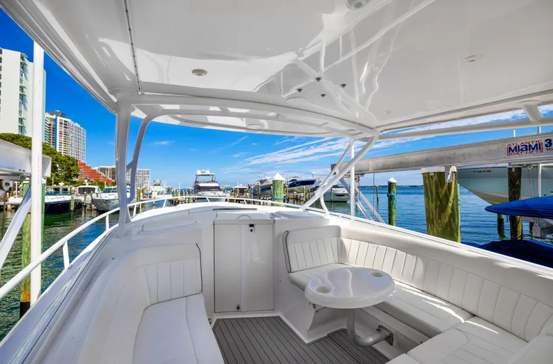  Yacht Photos Pics 2016 Intrepid 400 Cuddy boat docked at marina with white seating and table.