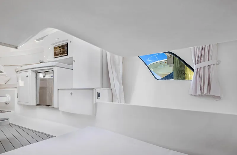  Yacht Photos Pics Interior of 2016 Intrepid 400 Cuddy with kitchenette and window view.