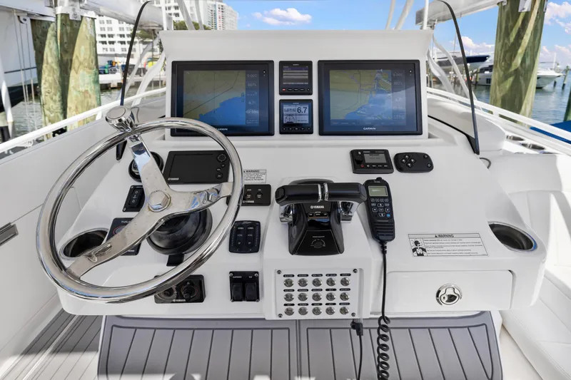  Yacht Photos Pics 2016 Intrepid 400 Cuddy boat helm with dual navigation screens and controls.