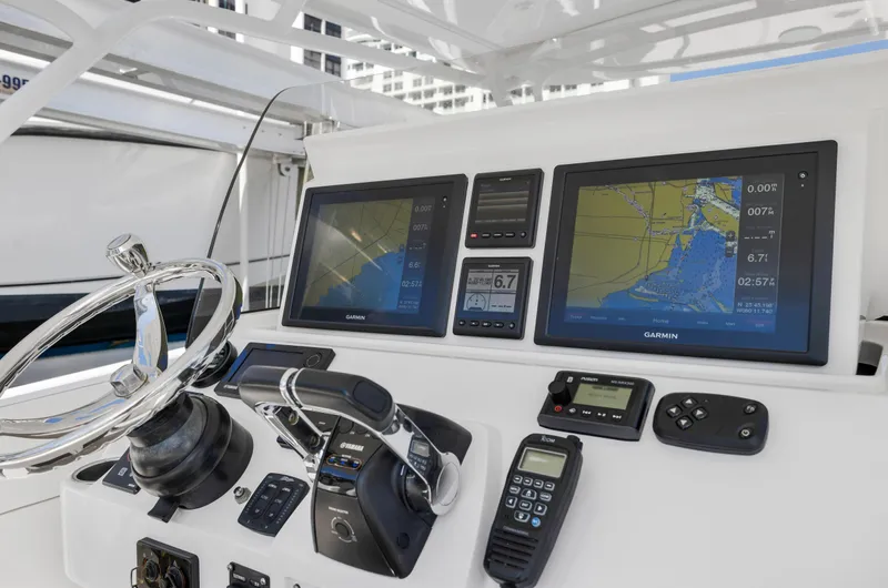  Yacht Photos Pics 2016 Intrepid 400 Cuddy helm with advanced navigation systems and controls.