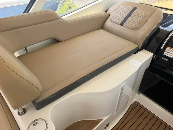  Yacht Photos Pics Luxurious seating on 2017 Sea Ray Sundancer 350 Coupe, featuring tan upholstery and elegant design.