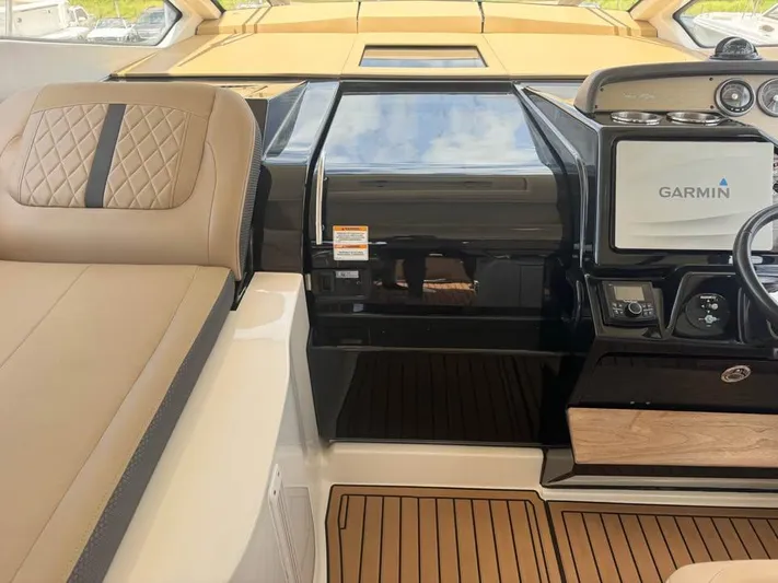  Yacht Photos Pics 2017 Sea Ray Sundancer 350 Coupe interior with Garmin navigation system and luxurious seating.