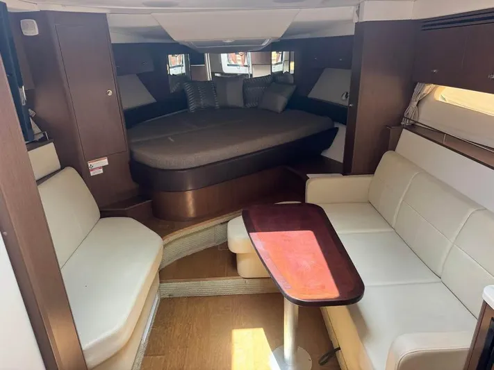  Yacht Photos Pics Interior of 2017 Sea Ray Sundancer 350 Coupe with cozy seating and bed.