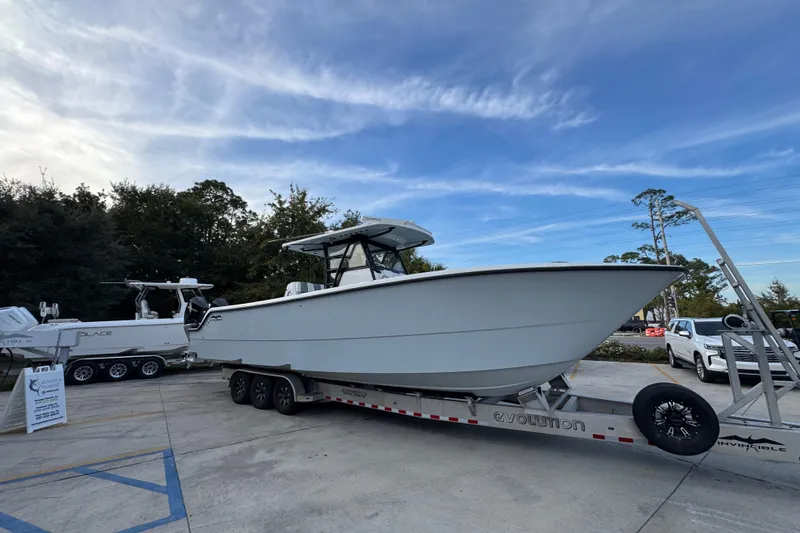  Yacht Photos Pics 2021 Invincible 35' Catamaran on trailer, parked outdoors under a blue sky.