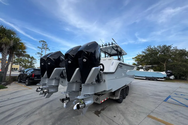  Yacht Photos Pics 2021 Invincible 35' Catamaran with triple outboard engines on trailer.