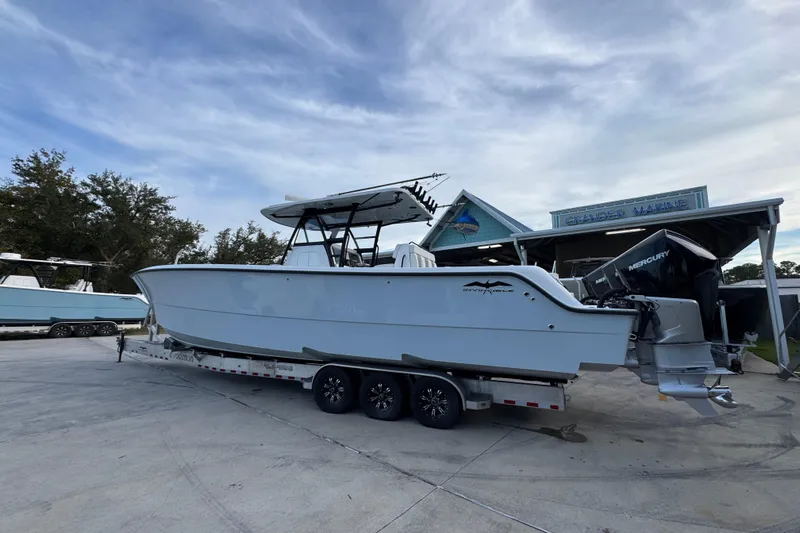  Yacht Photos Pics 2021 Invincible 35' Catamaran on trailer at Grander Marine dealership.