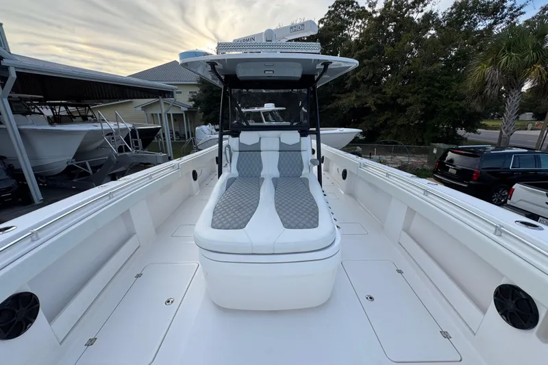  Yacht Photos Pics 2021 Invincible 35' Catamaran with sleek seating and modern design in a marina setting.