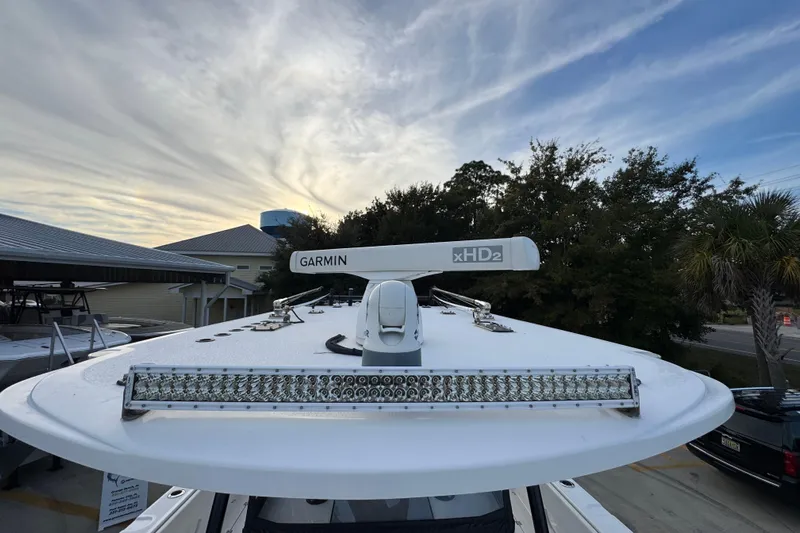  Yacht Photos Pics 2021 Invincible 35' Catamaran with Garmin xHD2 radar, docked under a cloudy sky.