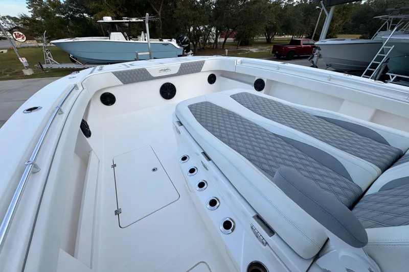  Yacht Photos Pics 2021 Invincible 35' Catamaran with spacious seating and sleek design in a marina setting.