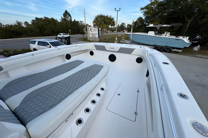  Yacht Photos Pics 2021 Invincible 35' Catamaran with spacious seating and sleek design in a marina setting.