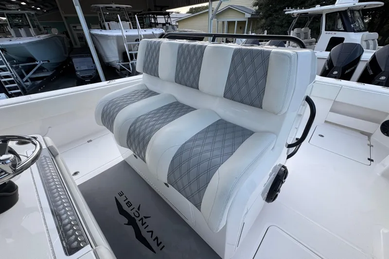  Yacht Photos Pics 2021 Invincible 35' Catamaran interior with plush seating and modern design.