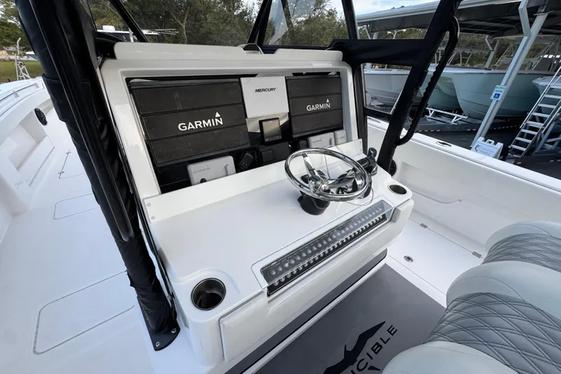  Yacht Photos Pics 2021 Invincible 35' Catamaran helm with Garmin navigation and Mercury controls.