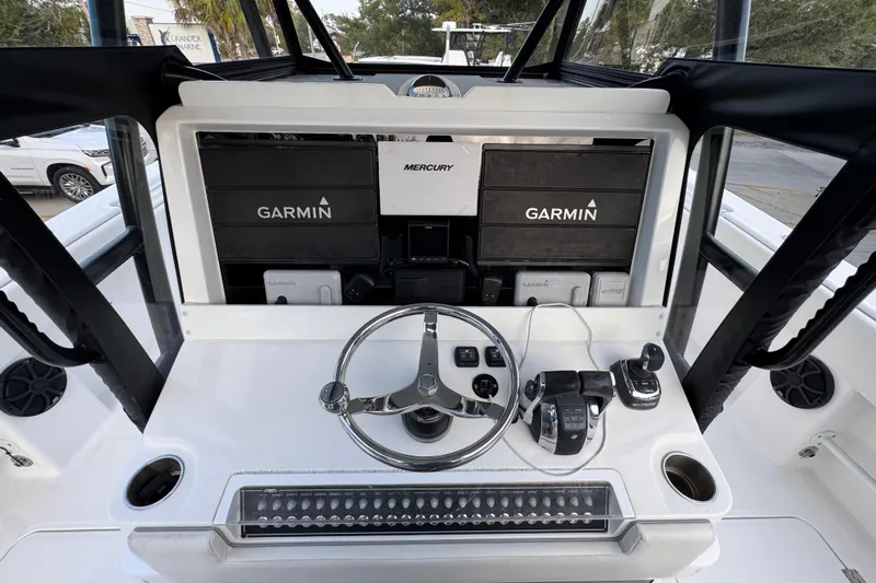  Yacht Photos Pics Helm of 2021 Invincible 35' Catamaran with Garmin navigation and Mercury controls.