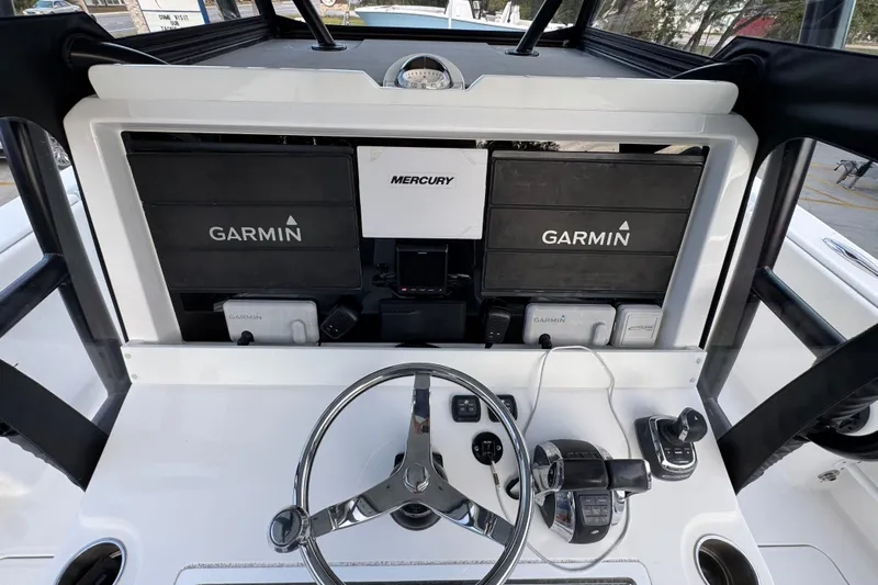  Yacht Photos Pics 2021 Invincible 35' Catamaran helm with Garmin and Mercury navigation systems.
