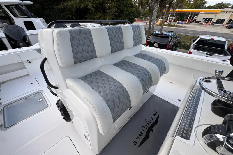  Yacht Photos Pics 2021 Invincible 35' Catamaran interior with plush seating and modern helm controls.