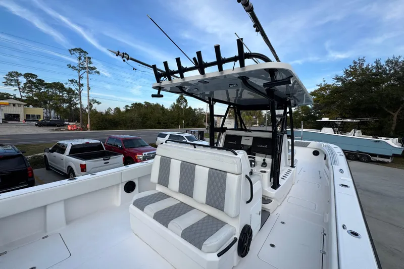  Yacht Photos Pics 2021 Invincible 35' Catamaran with seating and fishing equipment, parked outdoors.