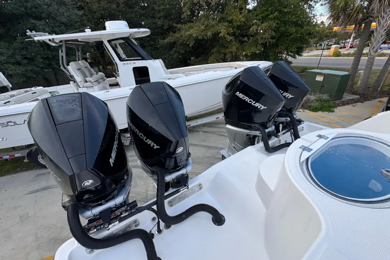  Yacht Photos Pics 2021 Invincible 35' Catamaran with triple Mercury outboard engines, parked on a trailer.