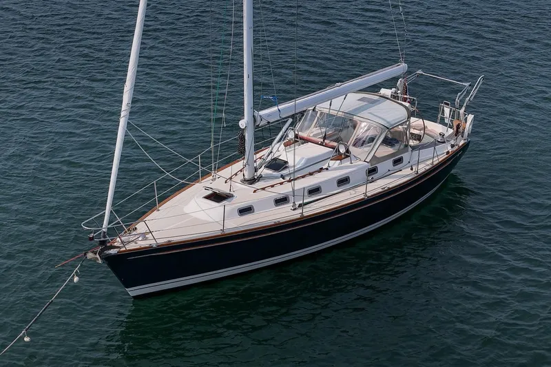 Jericho Yacht Photos Pics Sailboat Tartan 4100, 2002 model, anchored on calm water.