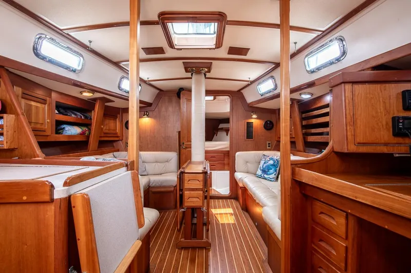 Jericho Yacht Photos Pics Luxurious 2002 Tartan 4100 yacht interior with wood finish and comfortable seating.