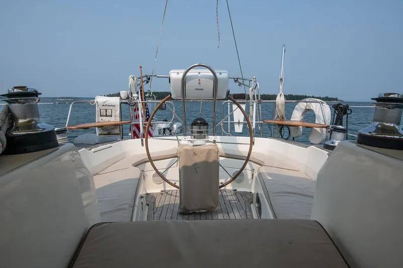Jericho Yacht Photos Pics Cockpit view of 2002 Tartan 4100 sailboat on calm waters.