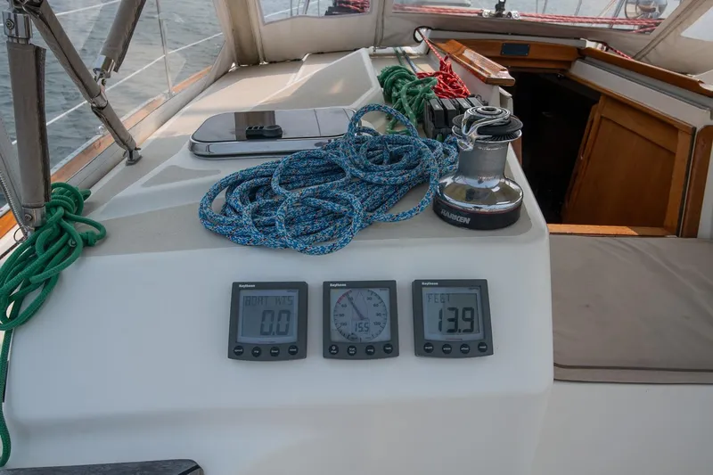 Jericho Yacht Photos Pics Cockpit of 2002 Tartan 4100 sailboat with ropes and navigation instruments.