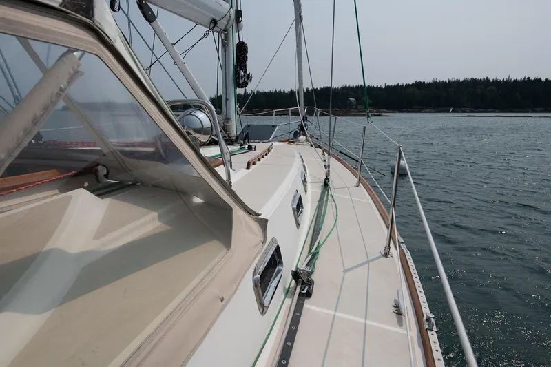 Jericho Yacht Photos Pics Sailing yacht Tartan 4100, 2002 model, cruising on calm waters.