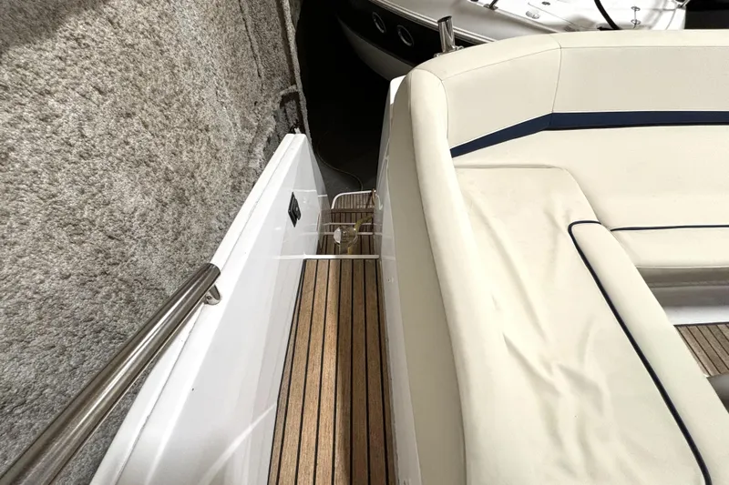  Yacht Photos Pics 2015 Beneteau Gran Turismo 49 yacht interior with white seating and wooden flooring.