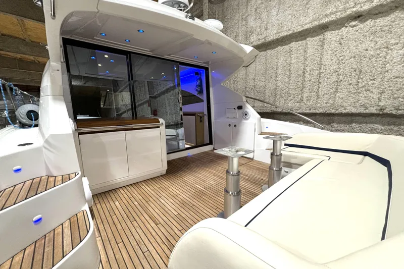  Yacht Photos Pics 2015 Beneteau Gran Turismo 49 yacht interior with sleek design and wooden flooring.