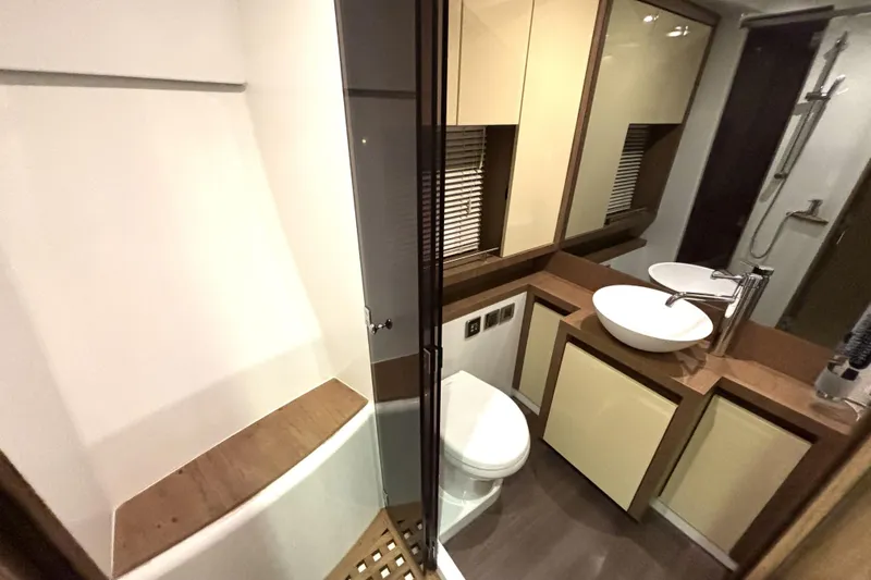  Yacht Photos Pics Luxurious bathroom in 2015 Beneteau Gran Turismo 49 yacht, featuring modern fixtures and elegant design.