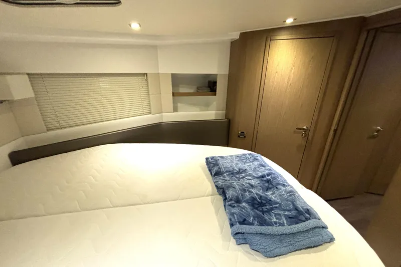  Yacht Photos Pics Luxurious cabin interior of 2015 Beneteau Gran Turismo 49 yacht with cozy bedding.