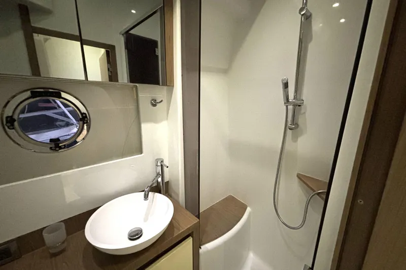  Yacht Photos Pics Bathroom interior of 2015 Beneteau Gran Turismo 49 yacht with shower and sink.
