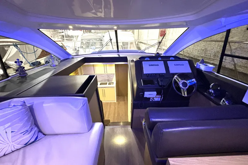  Yacht Photos Pics Interior of 2015 Beneteau Gran Turismo 49 yacht with modern helm and seating.