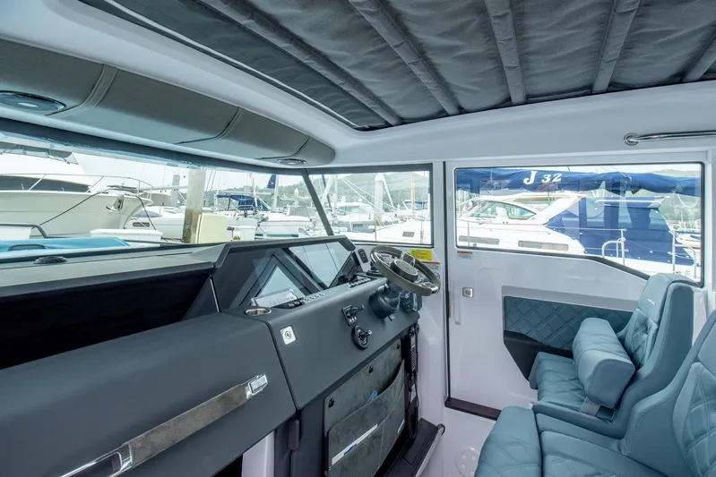 Egret Yacht Photos Pics Interior of 2023 Axopar 37 boat, featuring modern helm and comfortable seating.
