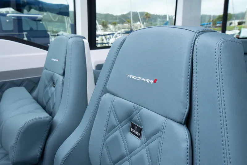 Egret Yacht Photos Pics Luxurious seating on 2023 Axopar 37 boat, featuring elegant stitching and branding.