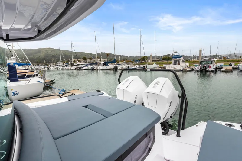 Egret Yacht Photos Pics 2023 Axopar 37 boat docked in a marina with twin Mercury engines.