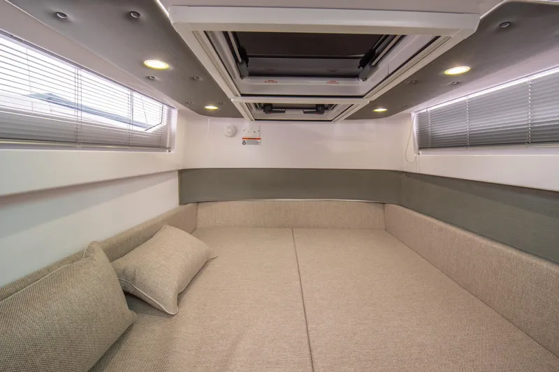 Egret Yacht Photos Pics Luxurious interior cabin of 2023 Axopar 37 boat with modern design and comfortable seating.